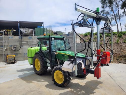 Front mounted herbicide sprayer
